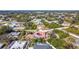 Aerial view of the house, highlighting the red tile roof, pool, and location within a neighborhood at 7148 & 7140 Coventry Ter, Englewood, FL 34224