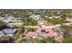 Aerial view of the house, highlighting the red tile roof, pool, and location within a neighborhood at 7148 & 7140 Coventry Ter, Englewood, FL 34224