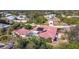 Aerial view of the house, highlighting the red tile roof, pool, and location within a neighborhood at 7148 & 7140 Coventry Ter, Englewood, FL 34224