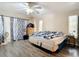 Serene bedroom with a king-size bed and access to a patio at 7148 & 7140 Coventry Ter, Englewood, FL 34224