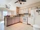 Bright kitchen with white appliances and ample cabinetry at 7148 & 7140 Coventry Ter, Englewood, FL 34224