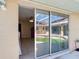 Glass sliding doors reveal a view of a private pool and patio area at 7148 & 7140 Coventry Ter, Englewood, FL 34224