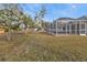 Large backyard with a screened pool at 87 Torrington St, Port Charlotte, FL 33954