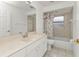 Bathroom with tub, shower, and updated vanity at 87 Torrington St, Port Charlotte, FL 33954