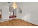 Dining area with hardwood floor and view into living room at 87 Torrington St, Port Charlotte, FL 33954