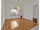 Dining room with hardwood floors and a chandelier at 87 Torrington St, Port Charlotte, FL 33954