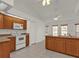 Kitchen features wood cabinets, ample counter space, and a breakfast bar at 87 Torrington St, Port Charlotte, FL 33954