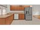 Kitchen with stainless steel appliances and wood cabinets at 87 Torrington St, Port Charlotte, FL 33954