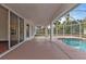 Enclosed pool area with patio and access to the house at 87 Torrington St, Port Charlotte, FL 33954