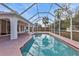 Inviting screened pool with a large deck at 87 Torrington St, Port Charlotte, FL 33954