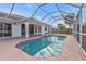 Refreshing screened pool perfect for summer at 87 Torrington St, Port Charlotte, FL 33954