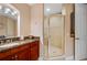 Bathroom with granite countertop, large shower, and updated vanity at 89 Vivante Blvd # 205, Punta Gorda, FL 33950