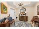 Bright condo entryway with decorative art and access to elevator at 89 Vivante Blvd # 205, Punta Gorda, FL 33950