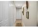 Bright hallway with neutral walls and ample closet space at 89 Vivante Blvd # 205, Punta Gorda, FL 33950