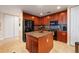 Modern kitchen with granite countertops and island at 89 Vivante Blvd # 205, Punta Gorda, FL 33950