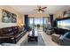 Spacious living room with water views and comfortable leather furniture at 89 Vivante Blvd # 205, Punta Gorda, FL 33950