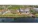 Aerial view of house, pool, dock, and canal at 9458 Snapper Cir, Port Charlotte, FL 33981