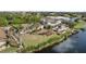 Aerial view of waterfront property with pool and dock at 9458 Snapper Cir, Port Charlotte, FL 33981