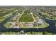 Aerial view of neighborhood with waterfront lots at 9458 Snapper Cir, Port Charlotte, FL 33981