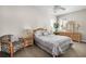 Bright bedroom with queen-size bed and wood furniture at 9458 Snapper Cir, Port Charlotte, FL 33981