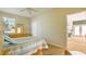 Bedroom with a queen-size bed, and access to another room at 9458 Snapper Cir, Port Charlotte, FL 33981