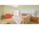 Large bedroom with a king-size bed and a cozy sitting area at 9458 Snapper Cir, Port Charlotte, FL 33981