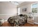 Guest bedroom with floral bedding and wood flooring at 9458 Snapper Cir, Port Charlotte, FL 33981