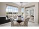 Bright breakfast nook with glass table and chairs, overlooking the pool at 9458 Snapper Cir, Port Charlotte, FL 33981