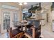 Breakfast nook with glass table and four chairs, near kitchen at 9458 Snapper Cir, Port Charlotte, FL 33981