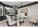 Elegant dining room with a glass table and chandelier at 9458 Snapper Cir, Port Charlotte, FL 33981