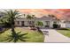 Single-story home with landscaped yard and palm trees at 9458 Snapper Cir, Port Charlotte, FL 33981