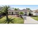 Single-story home with a landscaped yard and driveway at 9458 Snapper Cir, Port Charlotte, FL 33981