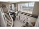 View of the home's interior, showing a staircase and access to an outside deck at 9458 Snapper Cir, Port Charlotte, FL 33981