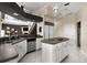 Modern kitchen with white cabinets, an island, and stainless steel appliances at 9458 Snapper Cir, Port Charlotte, FL 33981