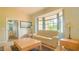 Living room with beige sofa and a large window at 9458 Snapper Cir, Port Charlotte, FL 33981