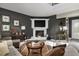 Living room with corner fireplace and large windows at 9458 Snapper Cir, Port Charlotte, FL 33981