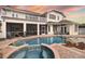 Large pool and spa with brick pavers and beautiful sunset views at 9458 Snapper Cir, Port Charlotte, FL 33981