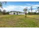 House exterior with backyard view and green space at 99 Sundiet St, Port Charlotte, FL 33954