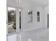 Bright living room with marble floors and modern entryway at 99 Sundiet St, Port Charlotte, FL 33954