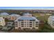 Aerial view of condo building, highlighting unit 105's location and exterior features at 10501 Amberjack Way # 101, Englewood, FL 34224