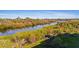 Beautiful Florida backyard with a relaxing river surrounded by lush vegetation and green scenery at 10501 Amberjack Way # 101, Englewood, FL 34224