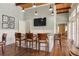 Community bar area with seating, TV and access to additional community areas at 10501 Amberjack Way # 101, Englewood, FL 34224