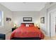 Well-lit bedroom featuring cozy decor, carpeted floors, and ample space at 10501 Amberjack Way # 101, Englewood, FL 34224