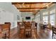 Large community room with wood floors, high ceilings and access to many seating areas at 10501 Amberjack Way # 101, Englewood, FL 34224