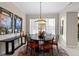 Modern dining room with round table and six chairs at 10501 Amberjack Way # 101, Englewood, FL 34224