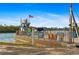 A car ferry stands ready to transport vehicles across the water with an American flag waving on top at 10501 Amberjack Way # 101, Englewood, FL 34224