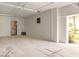 This single car garage is equipped with pipes, an exhaust fan, and a storage closet for parking and utilities at 10501 Amberjack Way # 101, Englewood, FL 34224