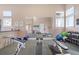 Well-equipped fitness center with modern weightlifting machines, weights and mirrors for a complete workout at 10501 Amberjack Way # 101, Englewood, FL 34224