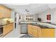 Open kitchen featuring stainless steel appliances, tile floors, and granite countertops at 10501 Amberjack Way # 101, Englewood, FL 34224