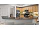 Bright kitchen boasts stainless appliances, granite counters, and ample cabinet space at 10501 Amberjack Way # 101, Englewood, FL 34224